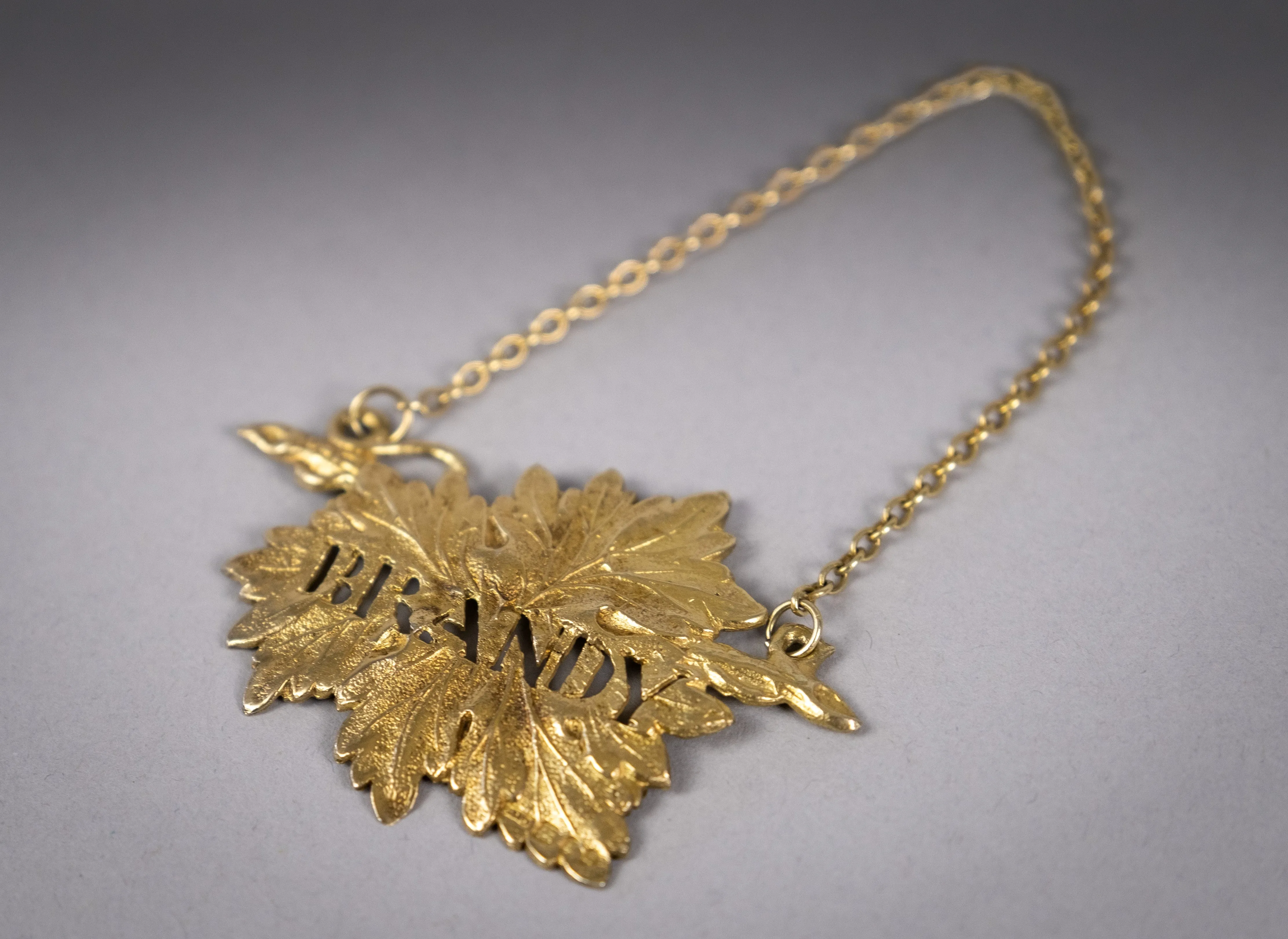 Four Silver Gilt Vine Leaf Decanter Labels by SMD, London, 1968.